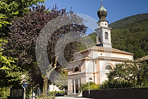 Church of Comano in Dolomites, Italy photo