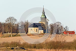 Church with cranes on the field