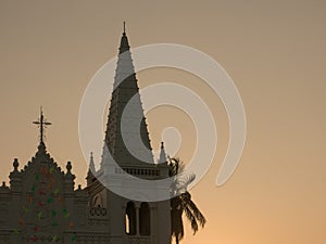 Church cross at sunset, Kochi, India photo