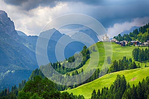 Church in Dolomites alps countryside meadow mountain