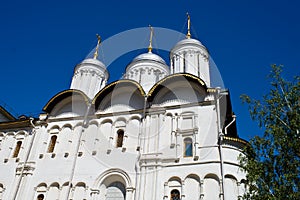 The church with domes under the blue sky