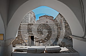 Church of 100 Doors viewed through arched window at Parikia, Paros, Greece