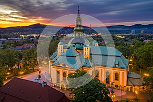 Church of the Exaltation of the Holy Cross in Jelenia Gora in Poland and the surrounding mountains at beautiful sunset