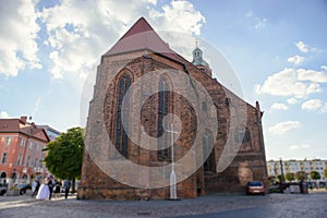 Church exterior during wedding ceremony. Blue sky with sunny weather