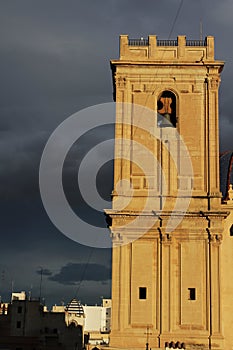 Church facade under threatening sky