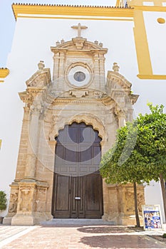church facade with yellow trim in Marbella, Andalucia Spain
