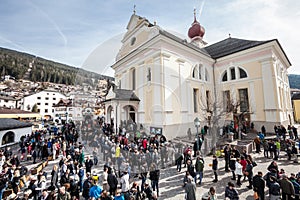 Church and the faithful. Easter in Ortisei, Italy.