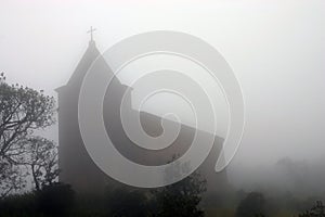 Church in fog. Bokor Hill near Kampot. Cambodia. photo