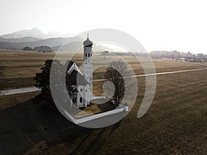 Church in front of foggy hills at sunset