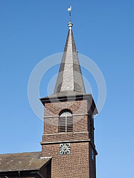 Church in Grevenbroich Wevelnghoven in Germany with blue sky