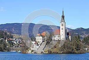 CHURCH with a high Bell Toweron Lake Bled in Slov