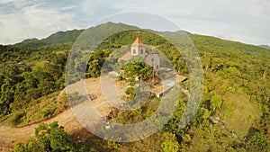 Church on a hill in Malbato village. Philippines. Coron. Palawan. Aerial view.