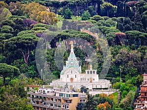Church on a hill with trees aerial view. Rome, Italy