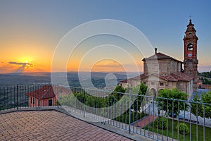 Church and hills of Langhe at sunset.