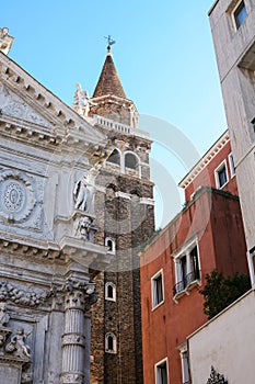 Church, houses and campanile tower in Venice photo