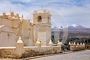 Church of the Immaculate Conception with mountains behind in Yanque, Colca Canyon, Peru.