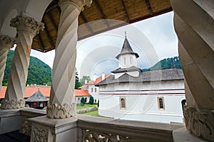 Church inside Sambata de Sus Monastery seen trough a colonade in