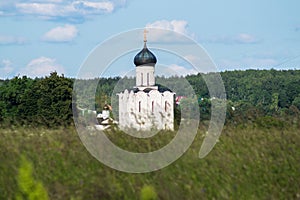 Church of the Intercession of the Holy Virgin on the Nerl River on the bright summer day.
