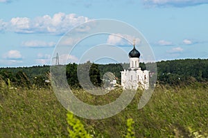 Church of the Intercession of the Holy Virgin on the Nerl River on the bright summer day.