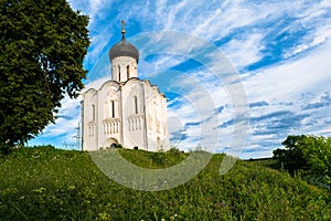 Church of the Intercession of the Holy Virgin on the Nerl River on the bright summer day.