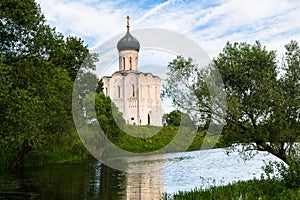 Church of the Intercession of the Holy Virgin on the Nerl River on the bright summer day.