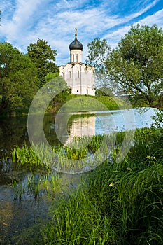 Church of the Intercession of the Holy Virgin on the Nerl River on the bright summer day.