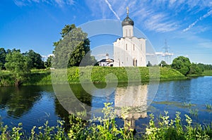 Church of the Intercession of the Holy Virgin on the Nerl River on the bright summer day.