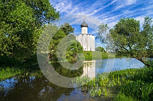 Church of the Intercession of the Holy Virgin on the Nerl River on the bright summer day.