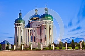 Church in the light of evening lanterns. Holy Protection Church in the city Dubno, Ukraine