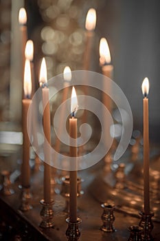 Church. Lighted candles in the church, close-up, prayer