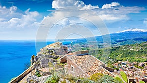 Church of Madonna della Rocca built on rock in Taormina, Sicily, Italy. Mount Etna is on horizon