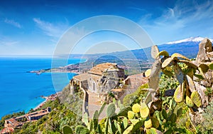 Church of Madonna della Rocca built on rock in Taormina and Mount Etna in Sicily, Italy photo