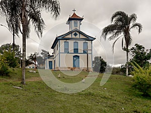 Church with many trees and lawn around, located in TrÃÂªs Barras. photo