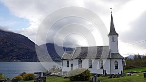Church of Nes at the Lusterfjord in autumn in Norway
