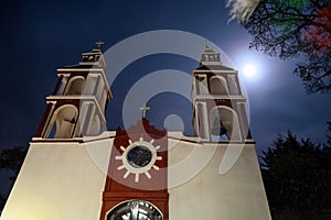 Church at night with a light. San Miguel de las Casitas Xichu Guanajuato Mexico