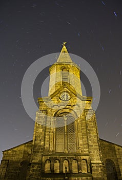 Church at night with star trails