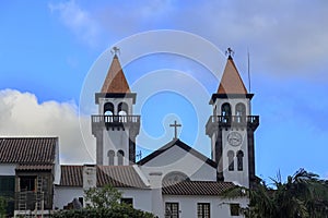 Church of Nossa Senhora da Alegria in Furnas with cloudy blue sky photo