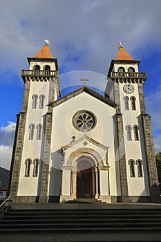 Church of Nossa Senhora da Alegria in Furnas with cloudy blue sky photo