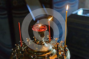 Church oil lamp in the orthodox church. Flame in the temple. Religious paraphernalia. Orthodox Church symbol of faith