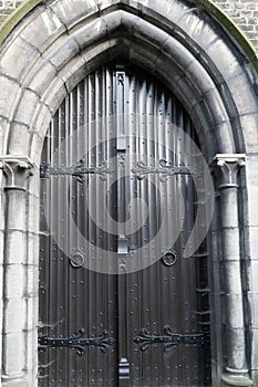 Church with old wooden door, and arched entrance