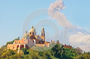 Church of Our Lady of Remedies with Popocatepetl Volcano, Mexico photo