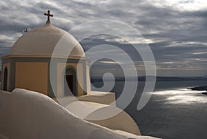Church Overlooks Santorini Caldera on Rainy Day