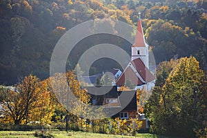 Church in Pernek, Slovakia village with forest