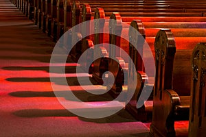 Church Pews in Reflected Stained Glass Lighting