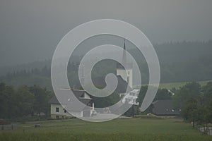 Church in Prichovice village with fog