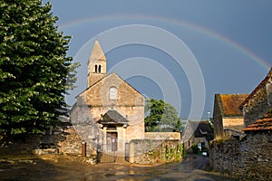 Church with a rainbow of Taize ,Burgundy.