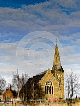 Church Reflected in River