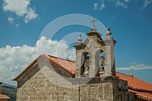 Church roof and campanile with bronze bells