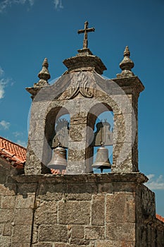 Church roof and campanile with bronze bells