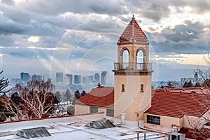 Church rooftop and bell tower with panoramic view of Salt Lake City downtown